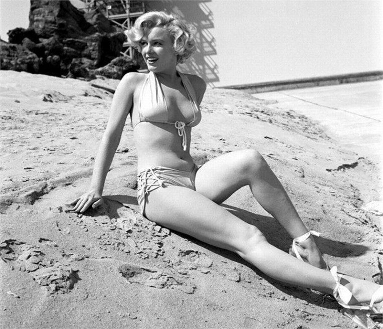 Berlin Monroe wore a two piece bikini to seduce Tigy Kunju Mathai and sat by the river side.